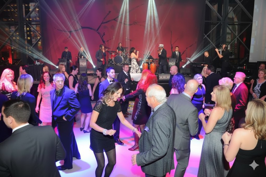 Unique Party Band performing on stage to a packed dance floor